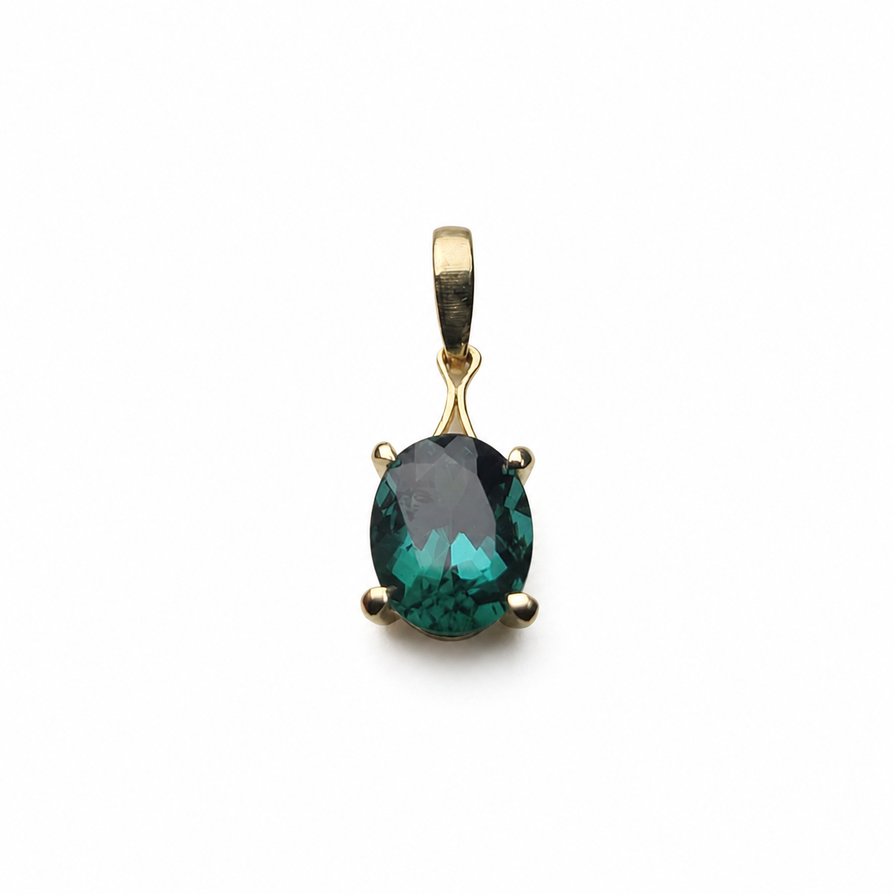 Custom lagoon tourmaline pendant and stud earrings set in 14K yellow gold, featuring 3.34 total carats of oval blue-green tourmalines.