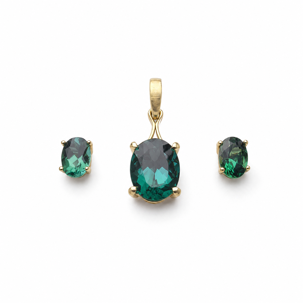 Custom lagoon tourmaline pendant and stud earrings set in 14K yellow gold, featuring 3.34 total carats of oval blue-green tourmalines.