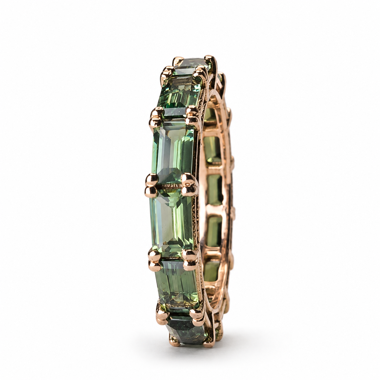 Green and teal sapphire eternity band featuring 5.09 carats of sapphires set continuously in 14K rose gold.