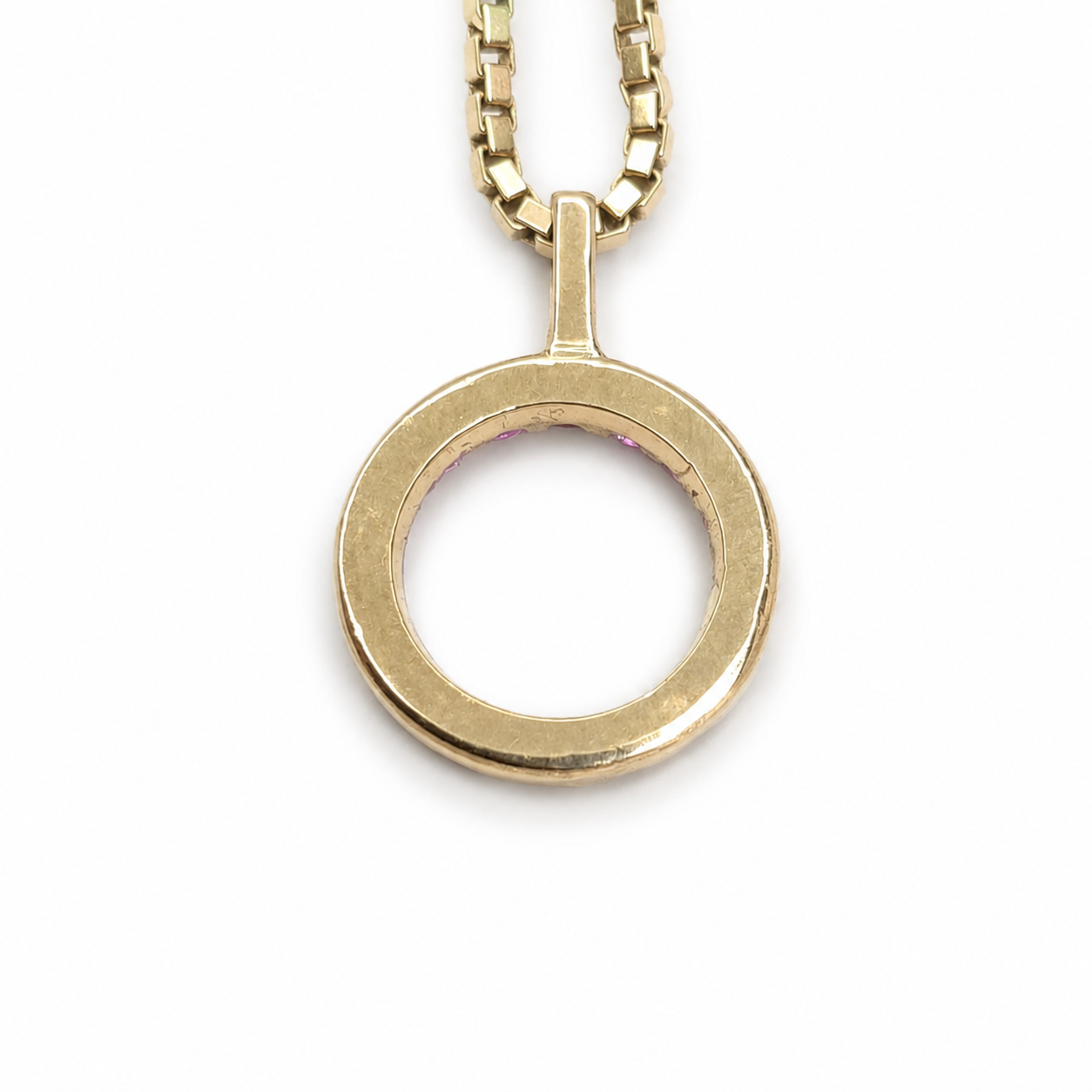Ruby eternity circle pendant featuring 0.51 total carats of round rubies set in polished 14K yellow gold