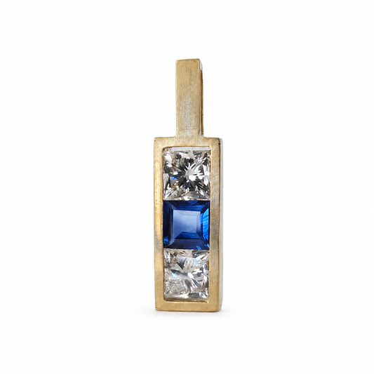 Handmade rectangular 14K yellow gold pendant with a square Ceylon sapphire between two channel-set lab-grown diamonds.