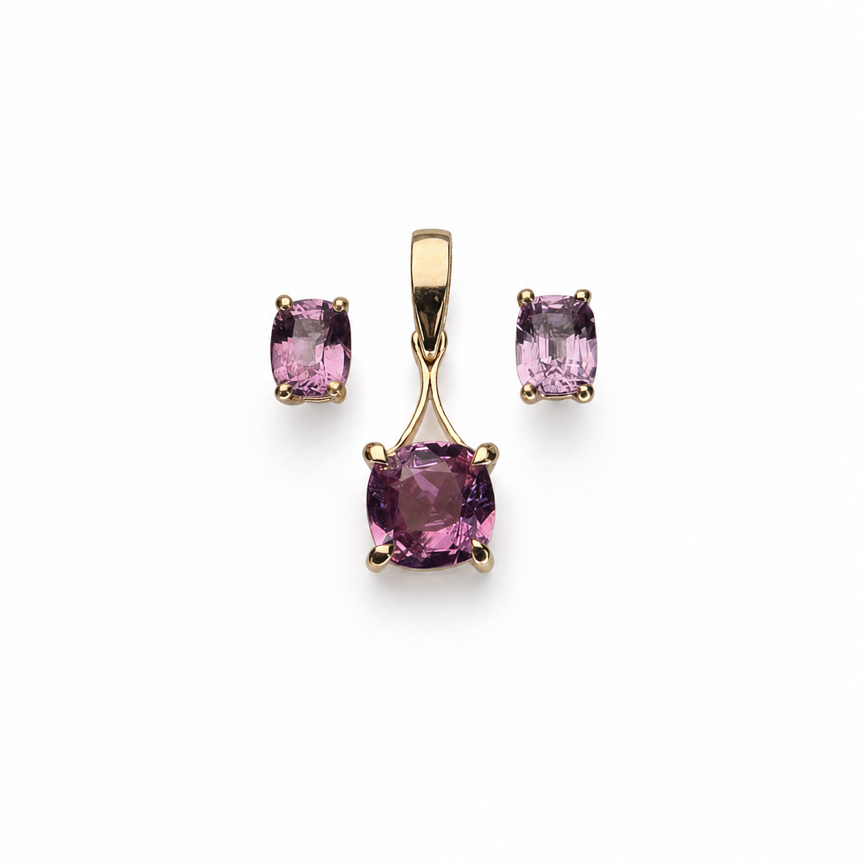 Mahenge Jedi spinel set with a cushion-cut pendant and matching oval stud earrings set in polished 14K yellow gold.