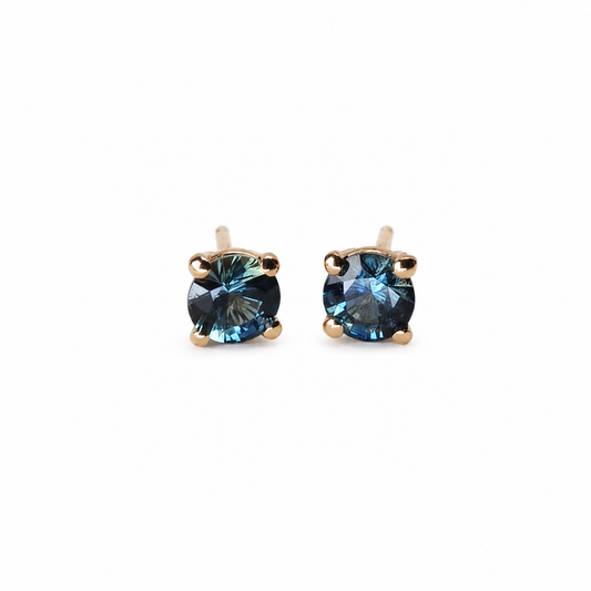 Pair of 3.5 mm round blue Montana sapphire stud earrings totalling 0.35 carats, set in polished 14K rose gold.